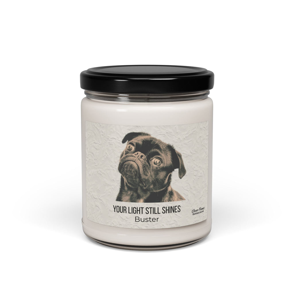 The Your Light Still Shines Personalized Pet Memorial Candle by Printify features a white jar with a black lid and a label with a black pug, the text “YOUR LIGHT STILL SHINES,” and pet’s name. A touching sympathy gift for pet lovers.