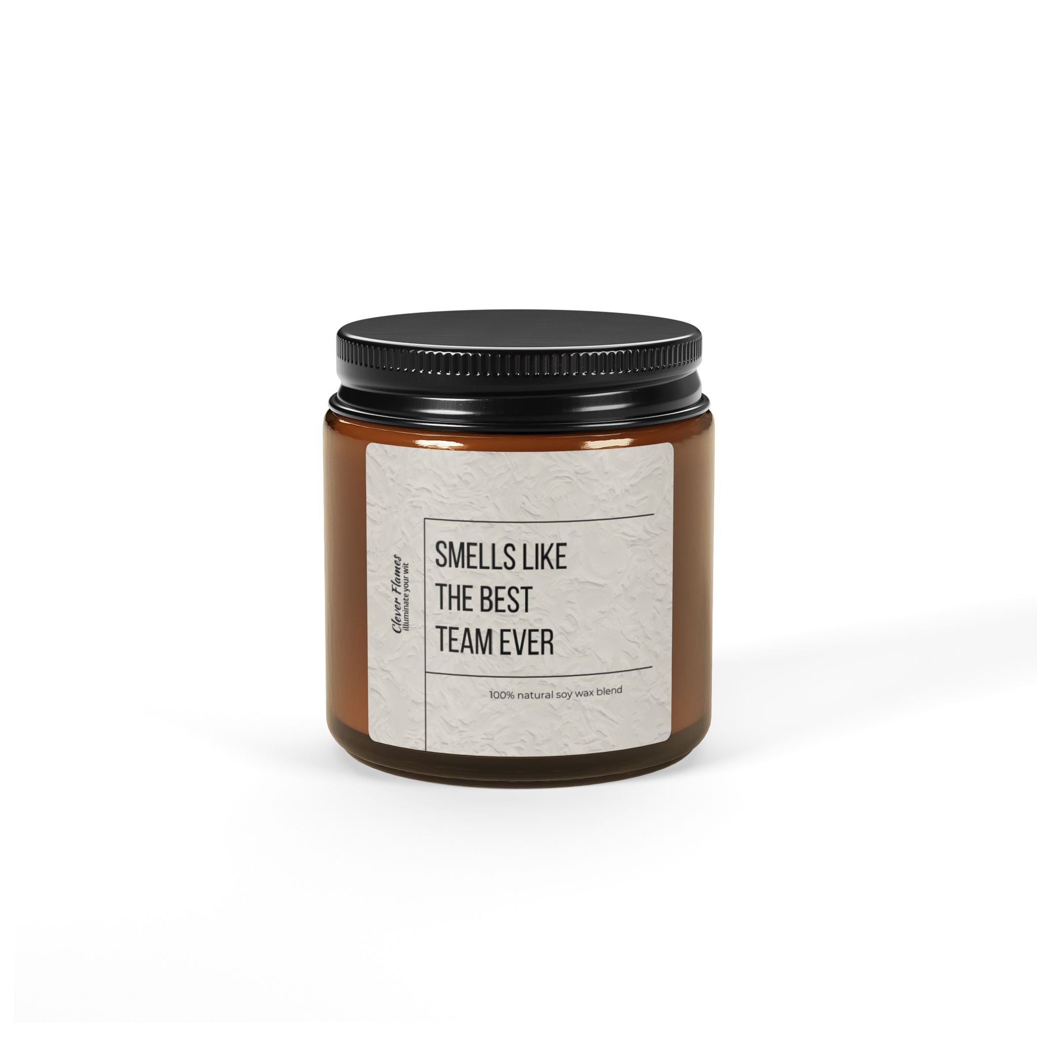 Introducing Printify's latest offering: the "Scented Soy Candle." This brown glass jar candle with a black lid is an ideal choice for corporate gifts. The label says "Smells Like The Best Team Ever" and features a 100% natural, eco-friendly scented soy wax blend. Perfect for showing appreciation to your team this holiday season.