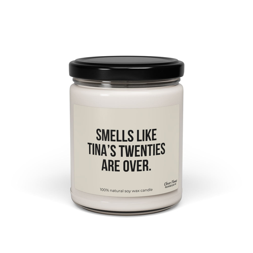 A white candle in a clear jar with a black lid, featuring a label that humorously reads, "SMELLS LIKE YOUR TWENTIES ARE OVER," making it an ideal gift for someone turning 30. Below that, it states "100% natural soy wax candle" and the brand is Printify.
