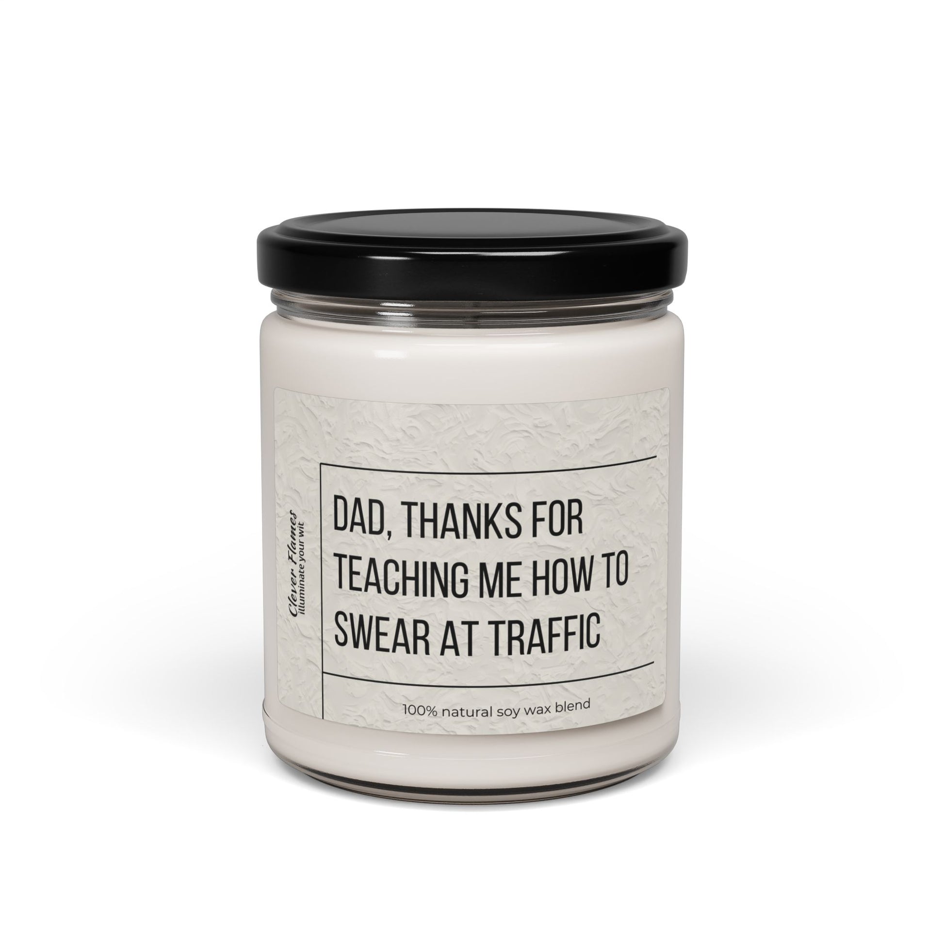 The Printify Funny Fathers Day Candle features a white soy wax blend in a reusable glass jar with black lid and reads, Dad, thanks for teaching me how to swear at traffic—a perfect gift from daughter or son for fun-loving dads.