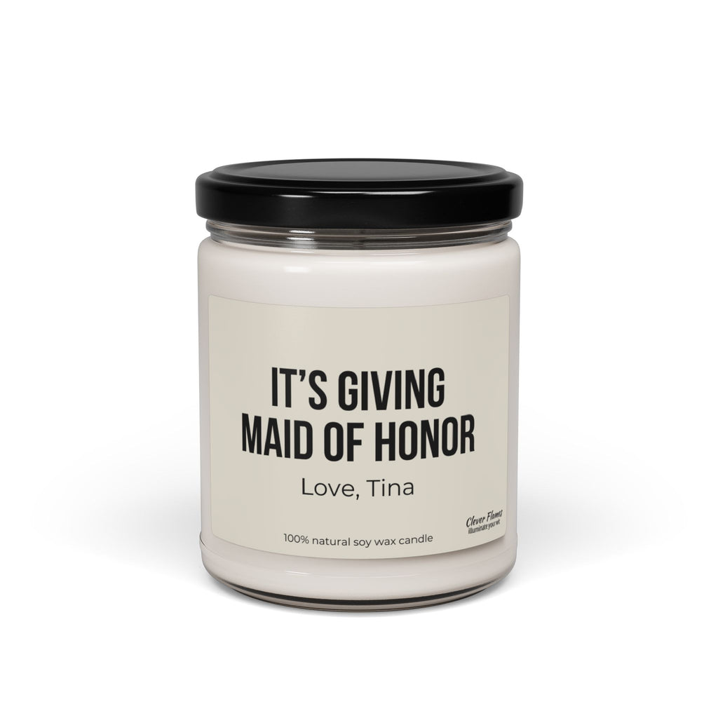 This custom soy wax candle by Wedding, featuring a white jar with a black lid, is the perfect gift for a maid of honor. The label says "ITS GIVING MAID OF HONOR, Love, Tina," making it an ideal choice for bridal party celebrations.