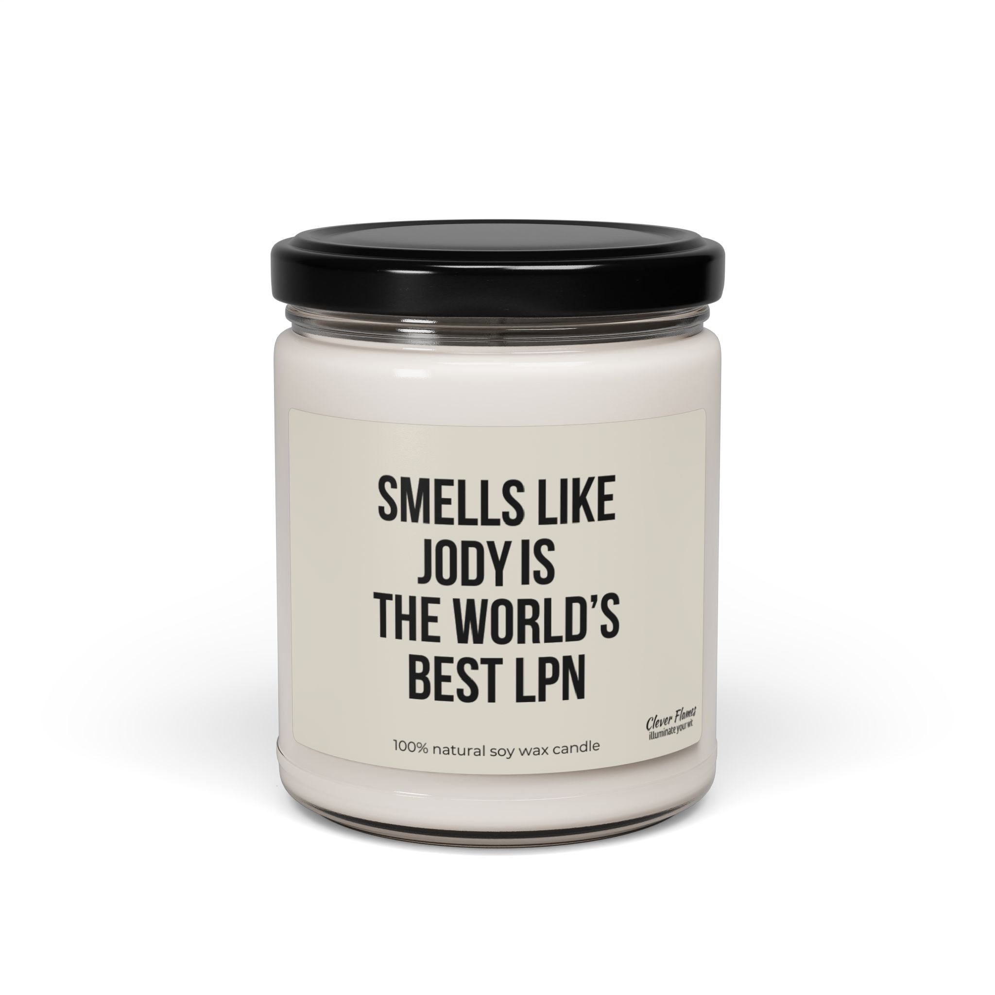 A white candle made from 100% natural soy wax comes in a glass jar with a black lid, featuring a label that reads, "Smells like the World's Best LPN." This personalized soy candle is an ideal gift option for nurses or those graduating as LPNs, offered by Printify.