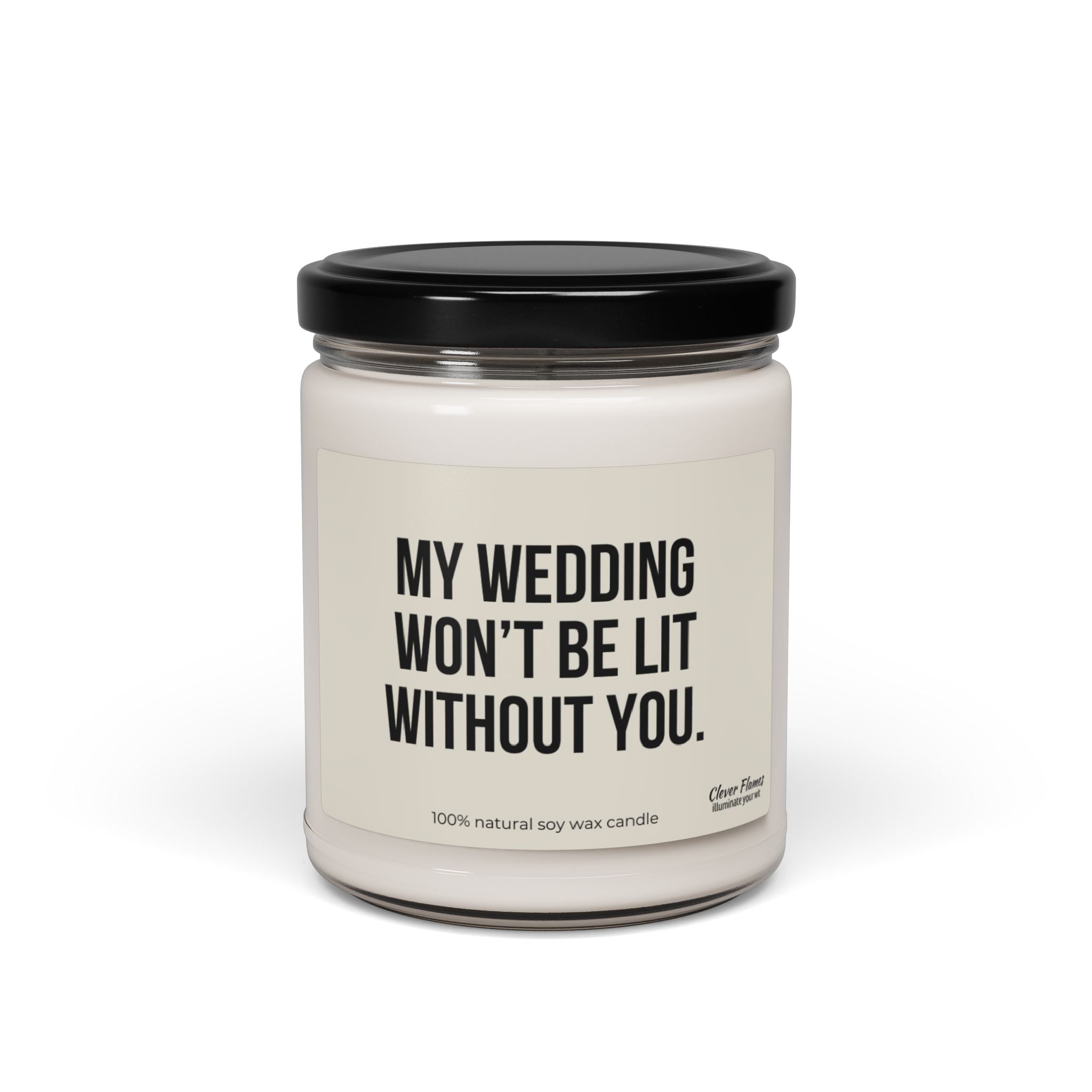 A white candle in a glass jar with a black lid features the label, "MY WEDDING WON'T BE LIT WITHOUT YOU." This bridesmaid candle from the Wedding brand is made from 100% eco-friendly soy wax, ensuring aromatic scents fill the air.