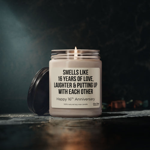 Celebrate your 16th anniversary with the “16 Years of Love, Laughter & Putting Up With Each Other Candle” by Printify. This unique candle comes in a glass jar with a label that reads: Smells like 16 years of love, laughter & putting up with each other. Happy 16th Anniversary. Crafted from 100% natural soy wax, it makes a funny and thoughtful anniversary gift—perfect for marking your special milestone together.
