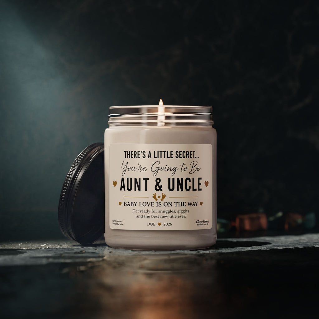A glowing Printify Pregnancy Announcement for Aunt and Uncle Candle sits in its jar, displaying the heartfelt message: “You’re going to be Aunt & Uncle. Baby love is on the way.” The lid rests nearby, while a softly blurred dark background sets the scene for a perfect baby reveal gift and memorable announcement moment.