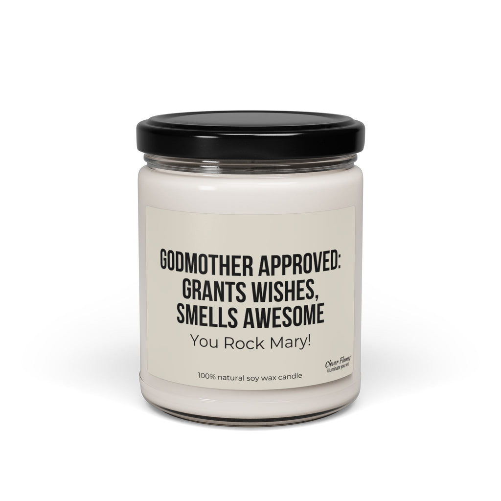Introducing the Personalized Godmother Gift for Baptism by Printify: a stylish white candle in a glass jar with a sleek black lid, ideal for christening occasions. The label reads, "GODMOTHER APPROVED: GRANTS WISHES, SMELLS AWESOME. You Rock Mary!" Crafted from 100% natural soy wax.