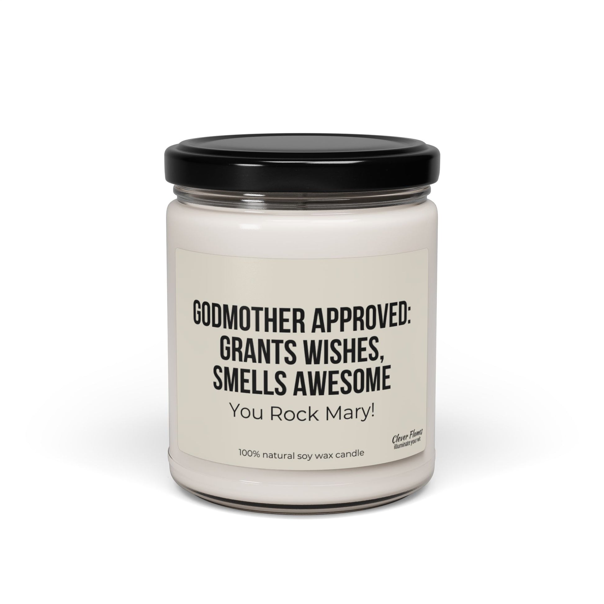 Introducing the Personalized Godmother Gift for Baptism by Printify: a stylish white candle in a glass jar with a sleek black lid, ideal for christening occasions. The label reads, "GODMOTHER APPROVED: GRANTS WISHES, SMELLS AWESOME. You Rock Mary!" Crafted from 100% natural soy wax.