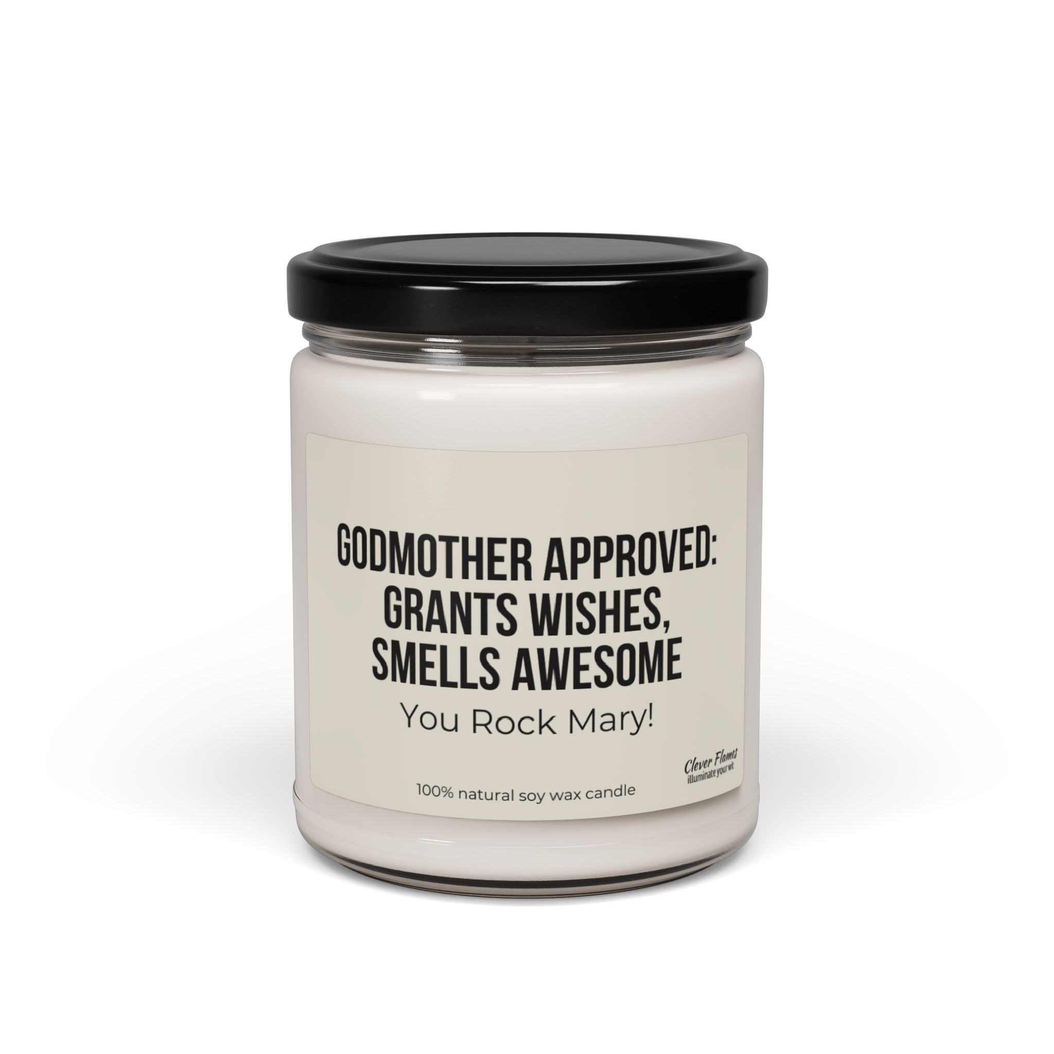 Introducing the Personalized Godmother Gift for Baptism by Printify: a stylish white candle in a glass jar with a sleek black lid, ideal for christening occasions. The label reads, "GODMOTHER APPROVED: GRANTS WISHES, SMELLS AWESOME. You Rock Mary!" Crafted from 100% natural soy wax.