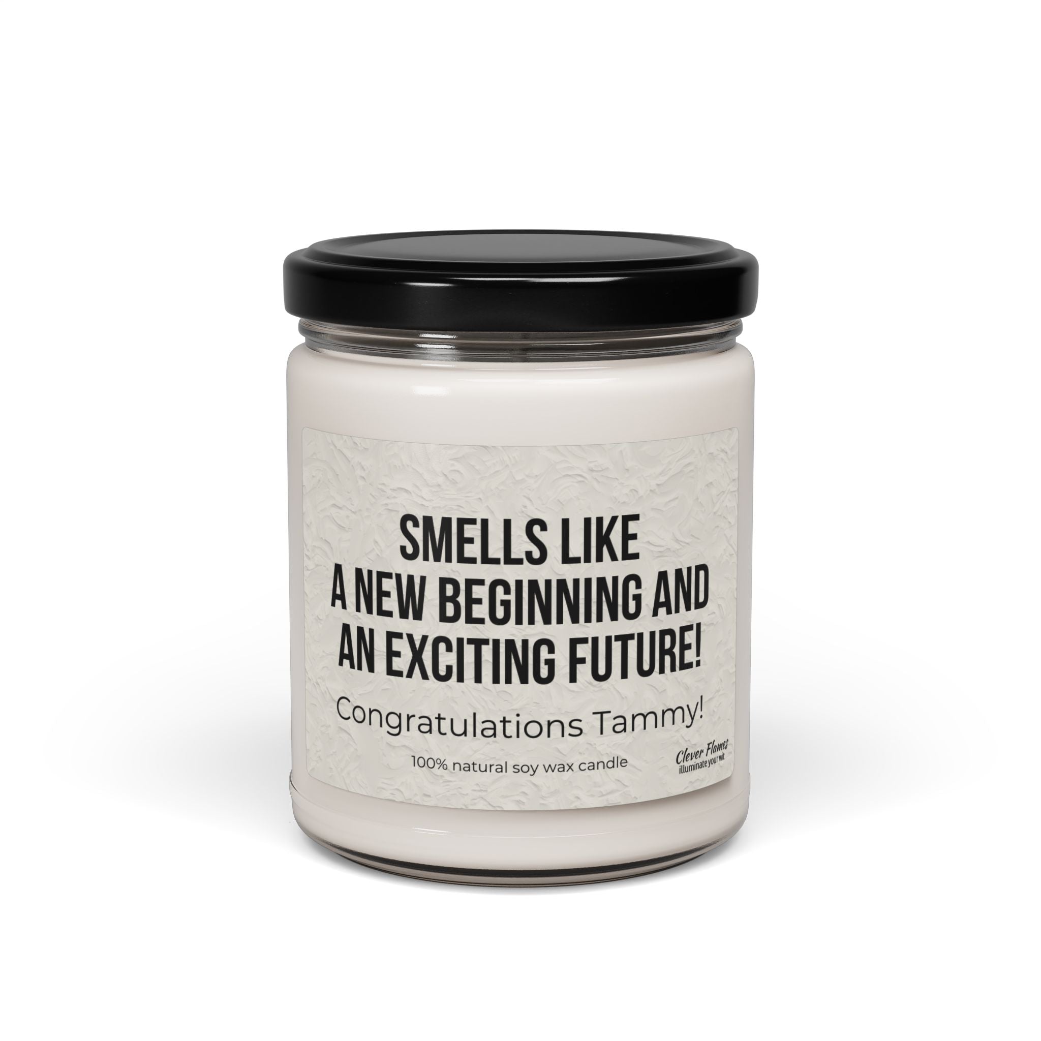 The Printify candle, Smells Like a New Beginning and an Exciting Future, is a white jar with a black lid. Made from 100% natural soy wax, its eco-friendly and perfect for celebrating new jobs or graduations. Personalize the label with Congratulations Tammy! for the ideal new start gift.