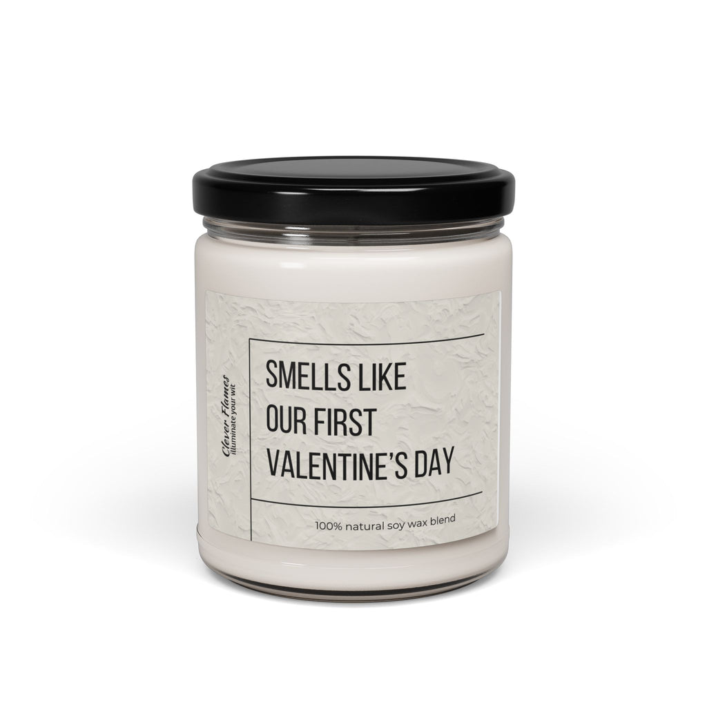 The Printify Smells Like Our First Valentines Day personalized romantic candle features a white soy wax blend in a glass jar with a black lid. Its elegant design and plain white background make it an ideal custom couples gift.