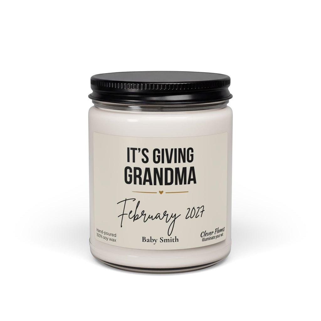 A white Grandma Pregnancy Announcement Candle in a glass jar with a black lid, labeled Its Giving Grandma with the date February 2027 and the name Baby Smith.