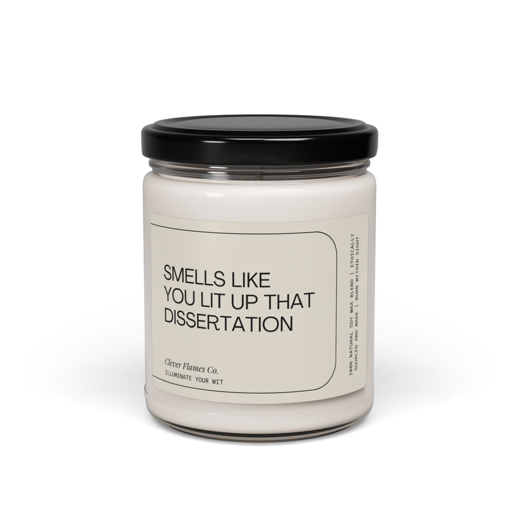 A white jar candle featuring a black lid stands elegantly against a plain white background. The label reads "You Lit Up that Dissertation," making it an ideal gift for PhD graduates. Crafted by Printify, this modern scented candle is perfect for celebrating academic achievements.