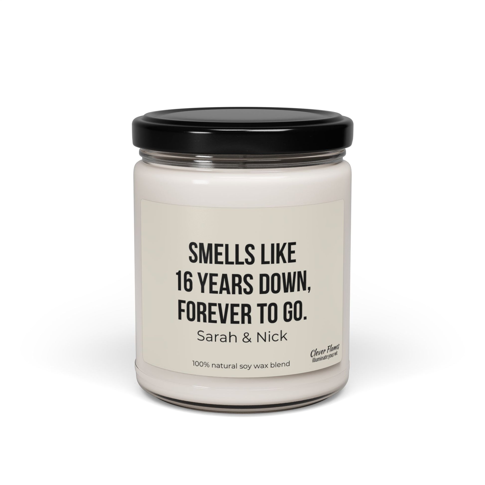 Introducing the perfect personalized gift to celebrate enduring love: the 16th Anniversary Candle by Wedding. This custom candle comes in a glass jar with a black lid, featuring a label that reads "SMELLS LIKE 16 YEARS DOWN, FOREVER TO GO. Sarah & Nick." Crafted from a 100% natural soy wax blend, it's an ideal way to commemorate your Wax Anniversary.