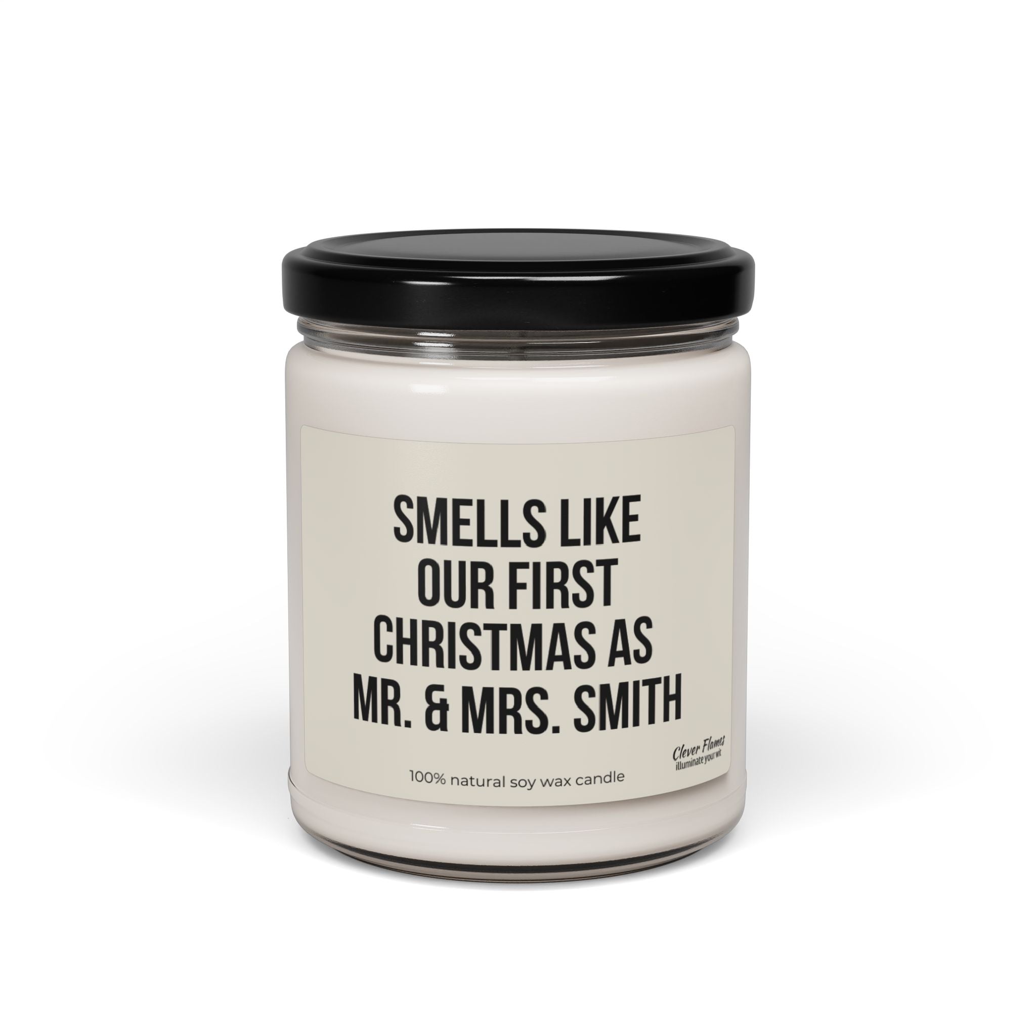 A personalized First Christmas candle from Printify, made of white soy wax in a glass jar with a black lid, is the perfect gift for newlyweds. The label says, "Smells like our first Christmas as Mr. & Mrs. Smith," making it an ideal choice for their first holiday together.