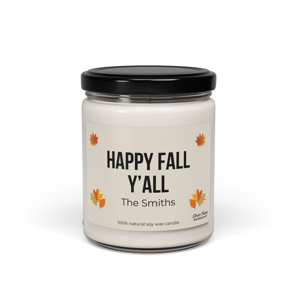 This scented soy candle from Printify, featuring a glass jar with a black lid, is labeled "Personalized Happy Fall Yall." Adorned with autumn leaves and customized with "The Smiths," it's perfect for fall decor. Made from 100% natural soy wax, it infuses your space with cozy autumn vibes.