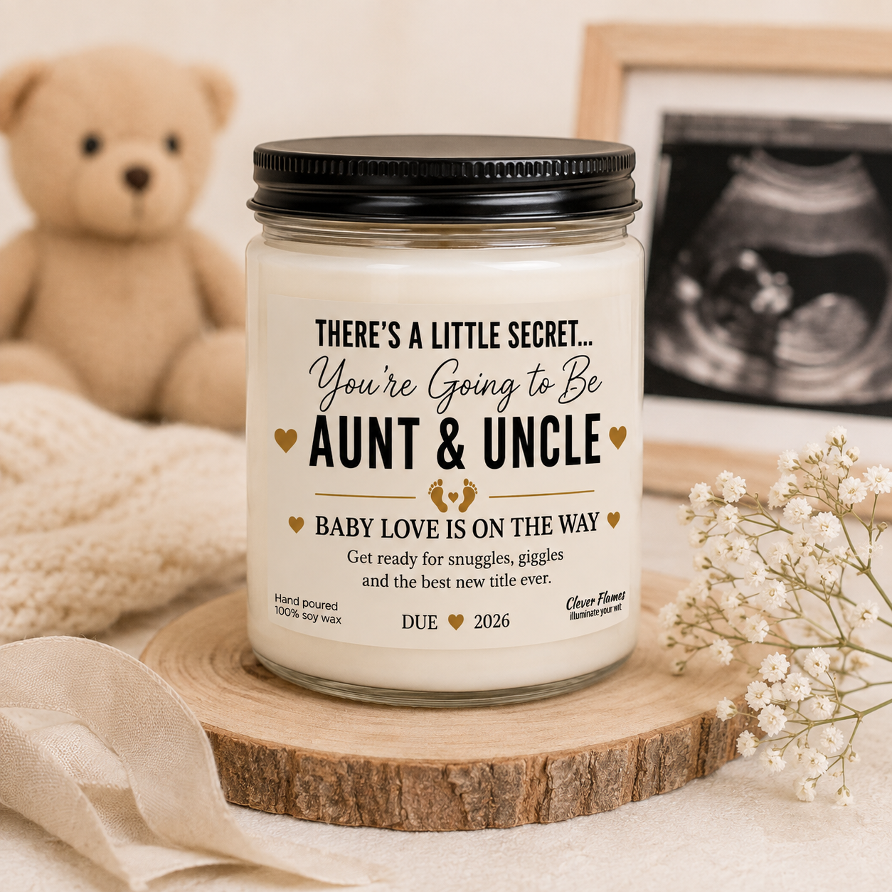 Announce your exciting news with the Printify Pregnancy Announcement for Aunt and Uncle Candle—a thoughtful baby reveal gift featuring a label that reads: “You’re going to be Aunt & Uncle. Baby love is on the way. Due 2026.” This charming pregnancy reveal idea looks beautiful next to an ultrasound photo, flowers, and cozy fabric, making it the perfect aunt and uncle gift for sharing your special announcement.