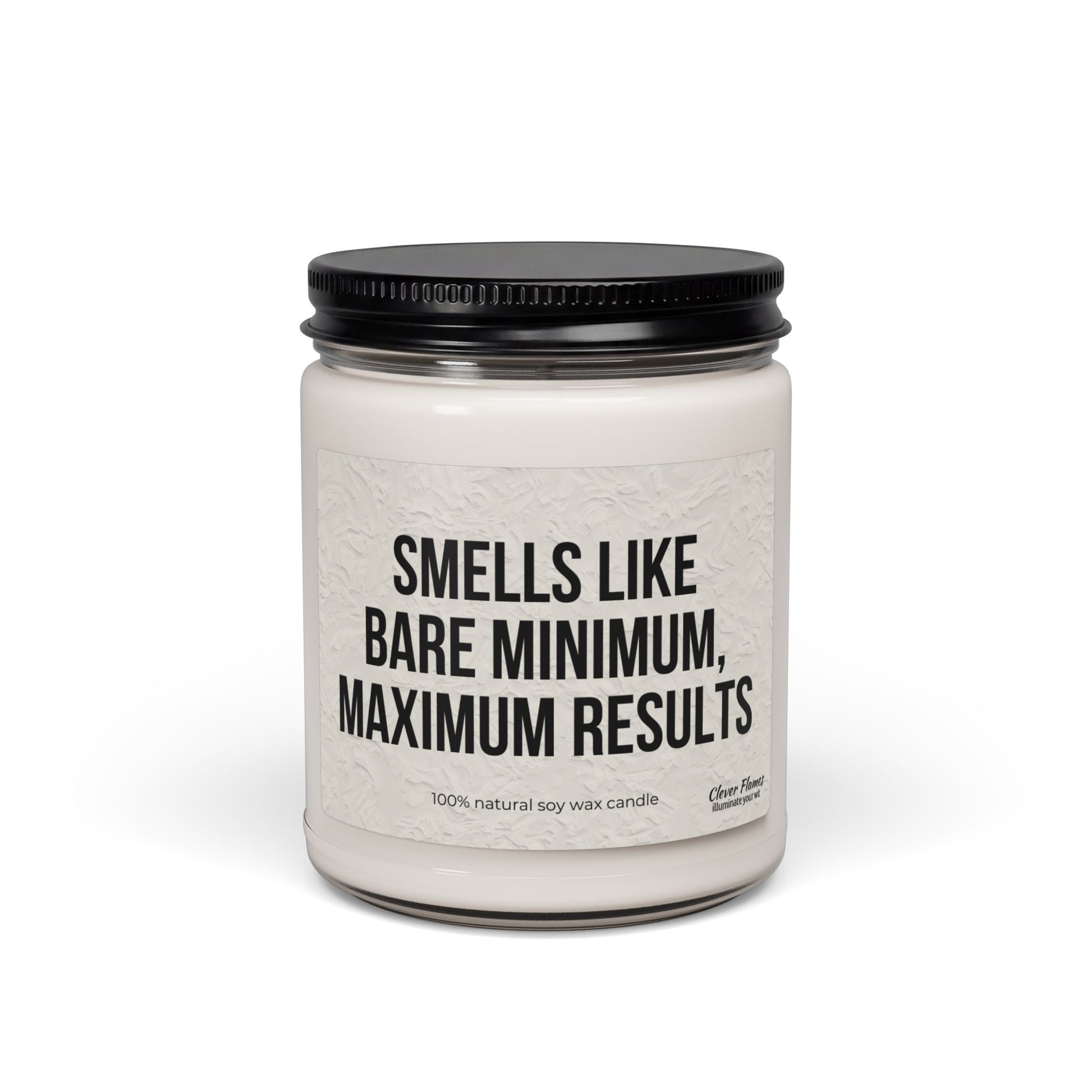 The Printify Soy Candle — "Smells Like Bare Minimum, Maximum Results" (9oz) is a white vegan candle in a reusable glass jar with black lid, labeled with its signature phrase and crafted from 100% natural soy wax.