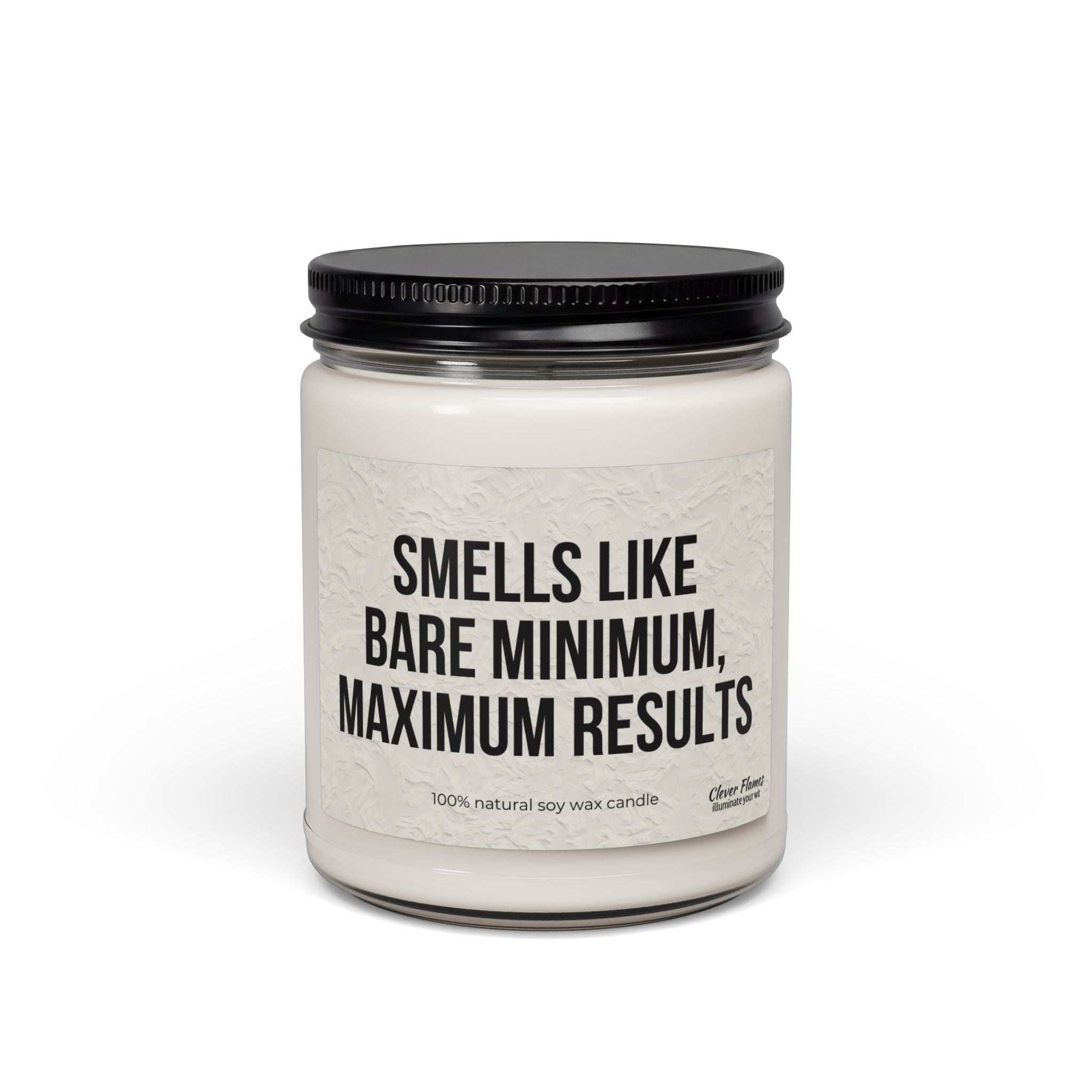 The Printify Soy Candle — "Smells Like Bare Minimum, Maximum Results" (9oz) is a white vegan candle in a reusable glass jar with black lid, labeled with its signature phrase and crafted from 100% natural soy wax.