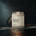A glowing, cream-colored scented soy candle from Printify rests in a glass jar on a dark surface. The label displays, "Smells like the best team ever." The lid is slightly off to the side, and the softly lit background enhances the room with pleasant aromas and fosters an eco-friendly cozy ambiance.