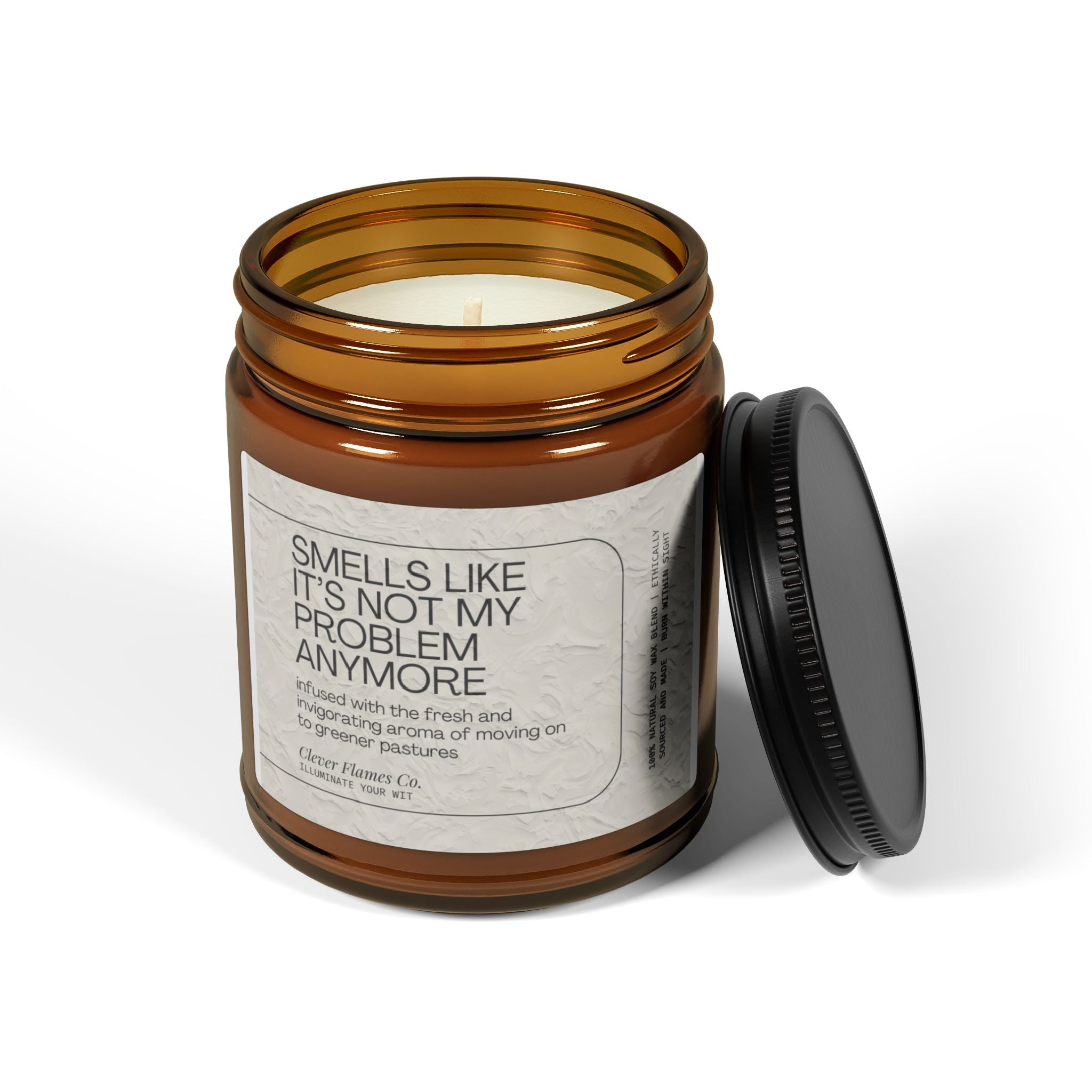 A brown glass jar candle from Printify, with the lid removed, showcases a label stating "Not My Problem Anymore," humorously themed around retirement. This eco-friendly soy candle has wax in a pale cream color, ideal for embracing your newfound freedom and celebrating life's next chapter.