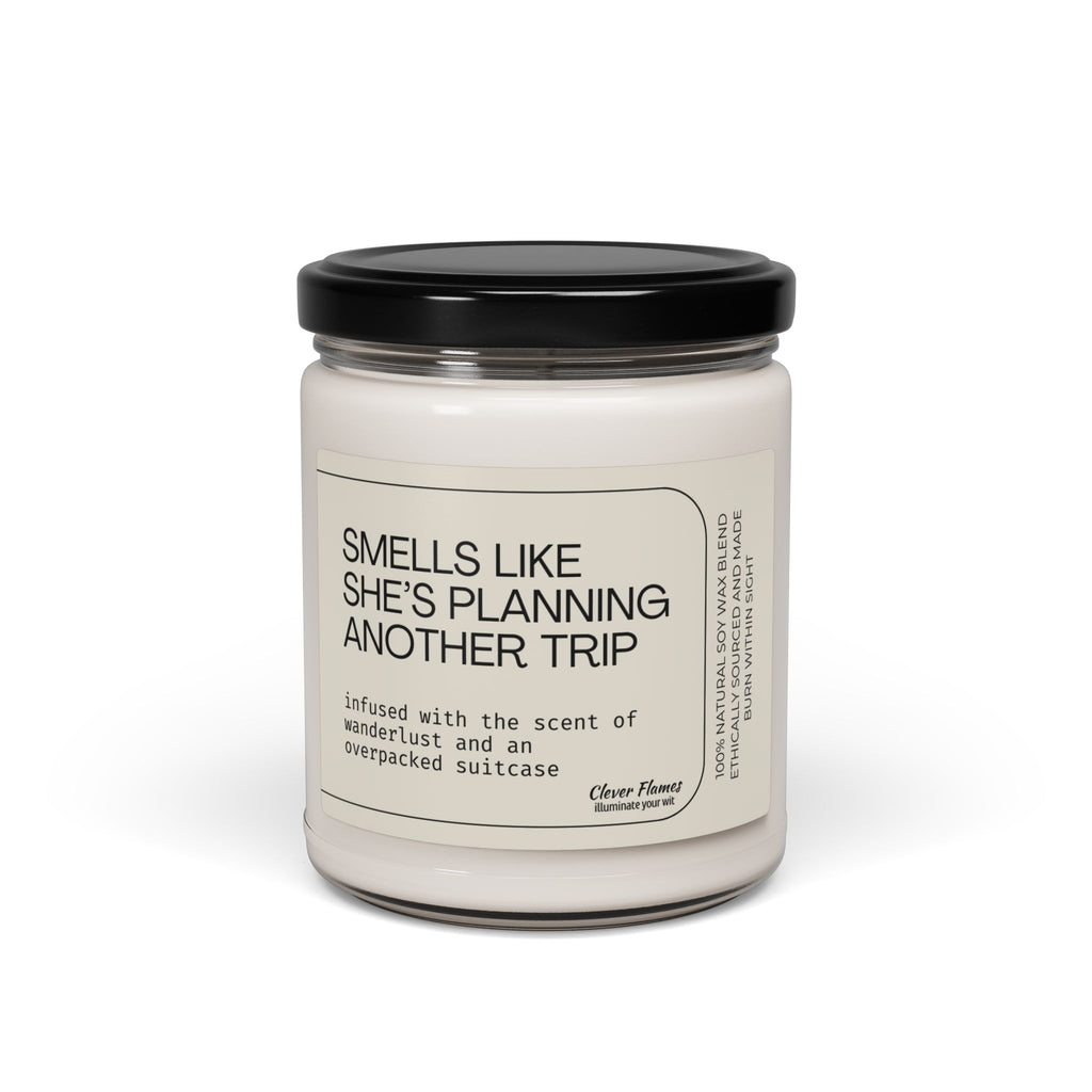 The Printify "Smells Like She's Planning a Trip" Soy Candle, 9oz, comes in a glass jar with a black lid and label inspired by wanderlust—perfect for travel lovers and makes a thoughtful gift.