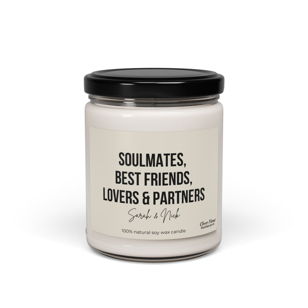 A custom soy wax candle housed in a glass jar with a black lid, featuring the label "Soulmates, Best Friends, Lovers & Partners - Sarah & Nick." This makes an ideal Anniversary Candle Gift, created by Wedding, for celebrating cherished moments together.