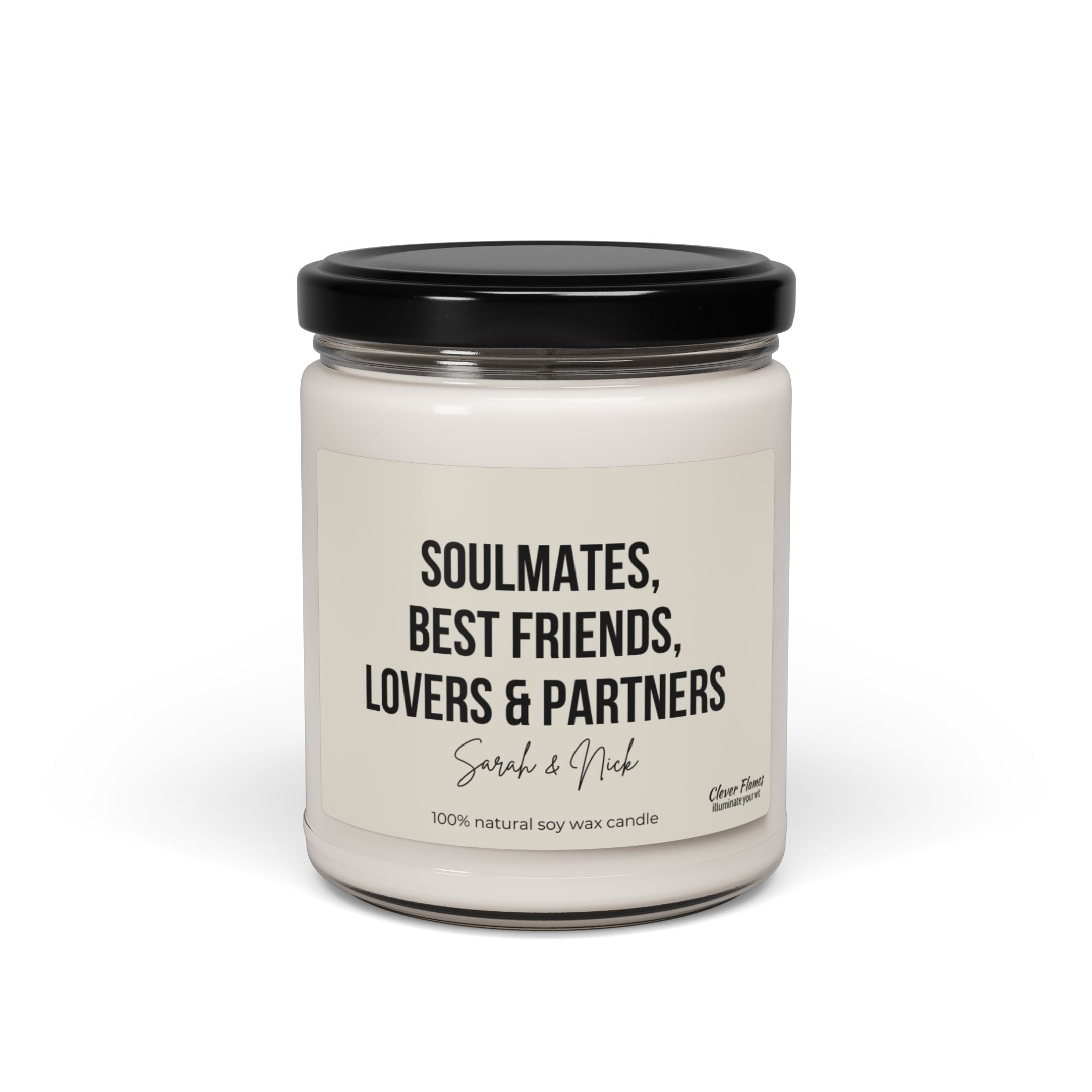 A custom soy wax candle housed in a glass jar with a black lid, featuring the label "Soulmates, Best Friends, Lovers & Partners - Sarah & Nick." This makes an ideal Anniversary Candle Gift, created by Wedding, for celebrating cherished moments together.