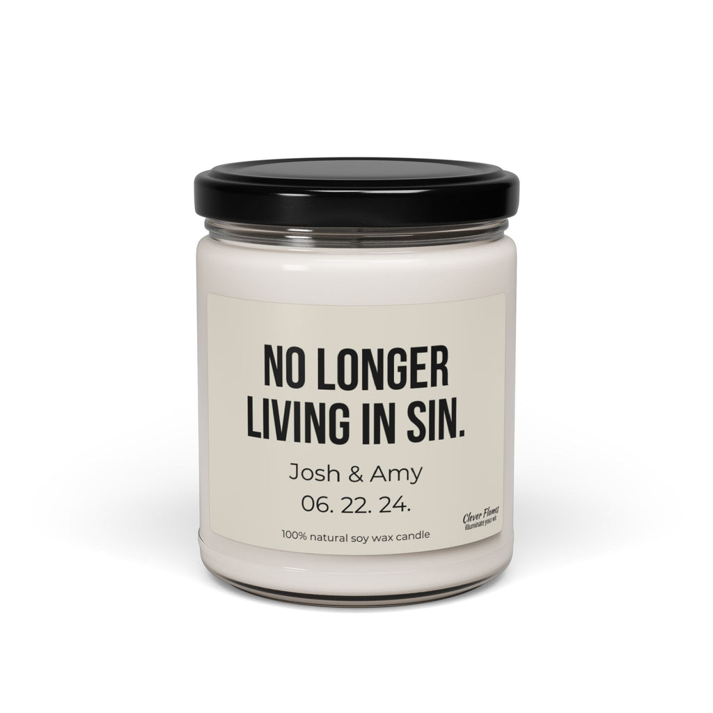 This custom soy candle from Wedding, featuring the humorous "No Longer Living In Sin" label, is an ideal anniversary gift. Personalized with "Josh & Amy 06.22.24," it celebrates their special day in a glass jar topped with a black lid and handcrafted from 100% natural soy wax for elegant charm.