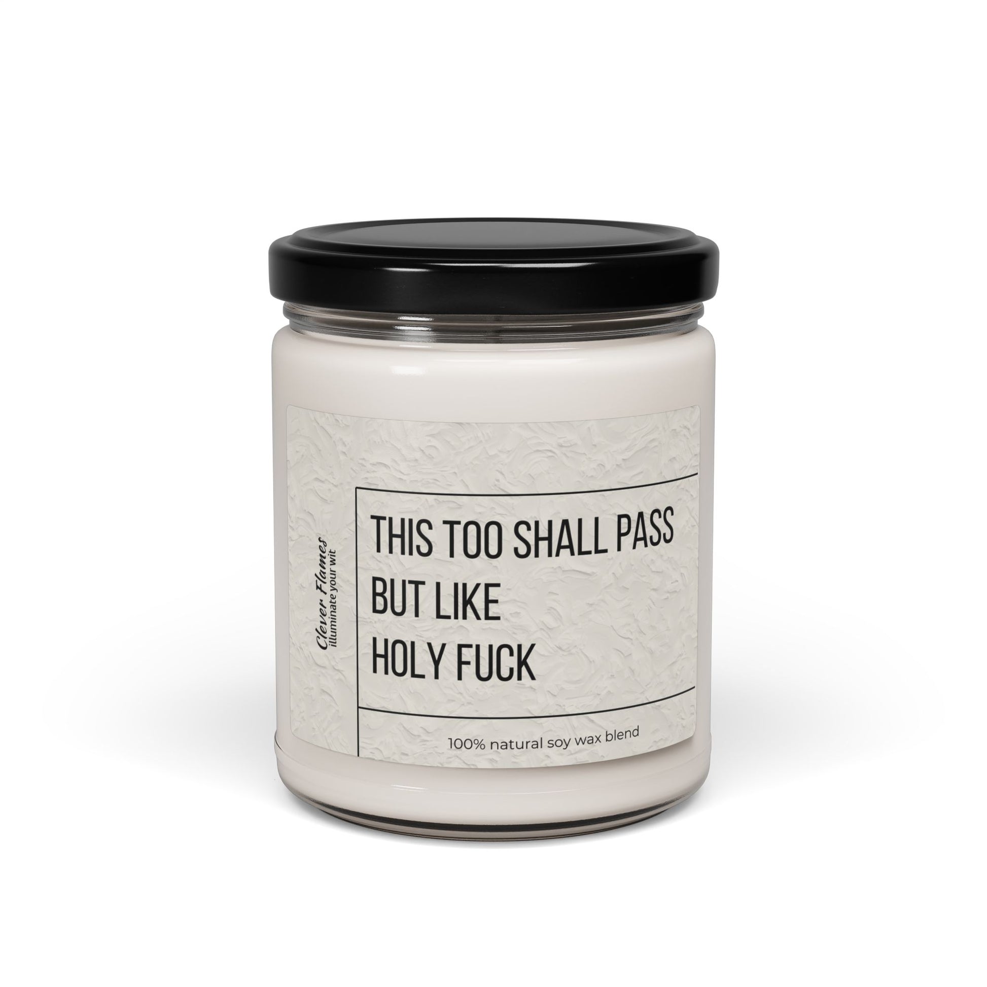 The Printify Humorous Scented Soy Candle, 9oz, features This Too Shall Pass, But Like Holy F*** on a white jar with black lid and label. Made from a 100% natural soy wax blend for unique aromatic experiences every burn.