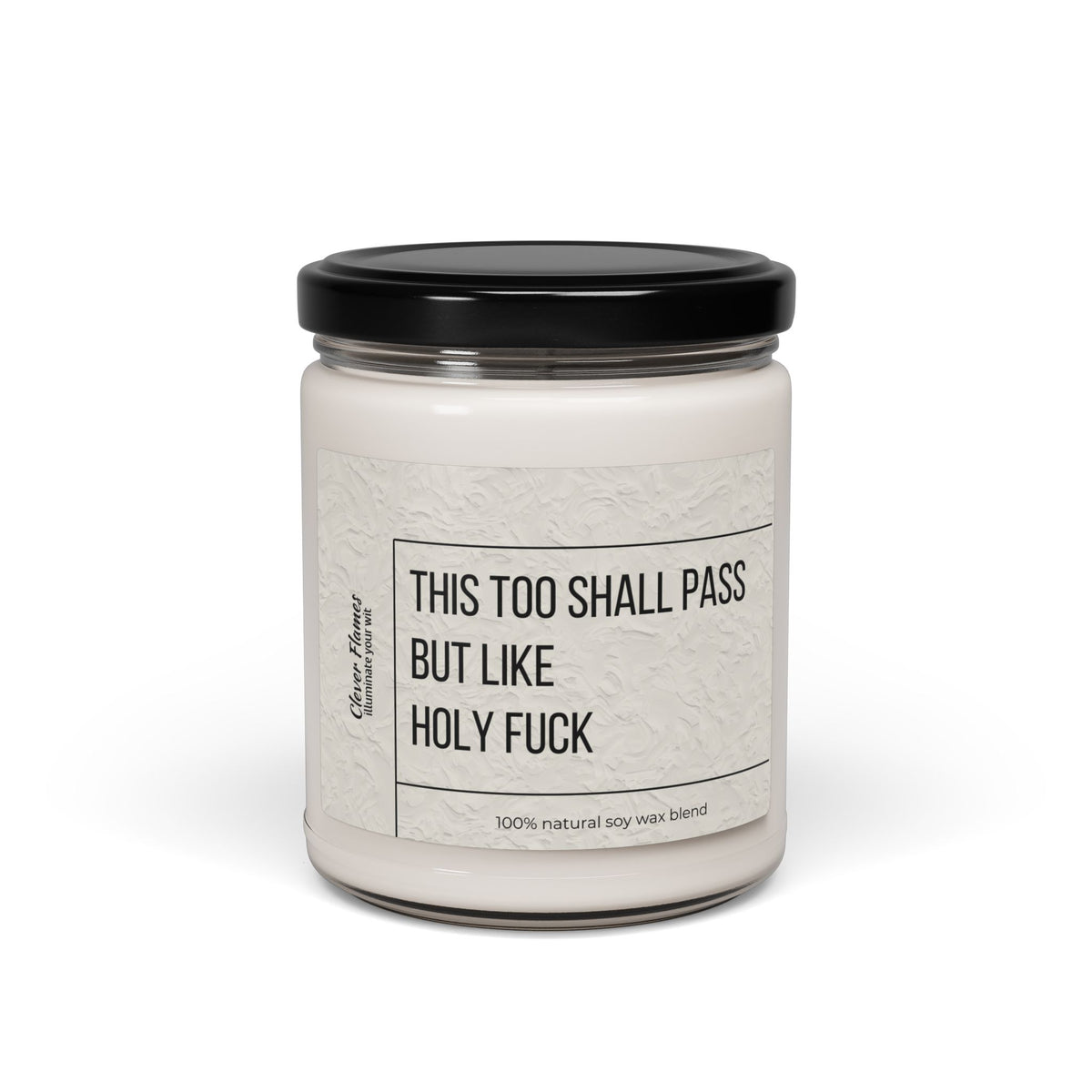 The Printify Humorous Scented Soy Candle, 9oz, features This Too Shall Pass, But Like Holy F*** on a white jar with black lid and label. Made from a 100% natural soy wax blend for unique aromatic experiences every burn.