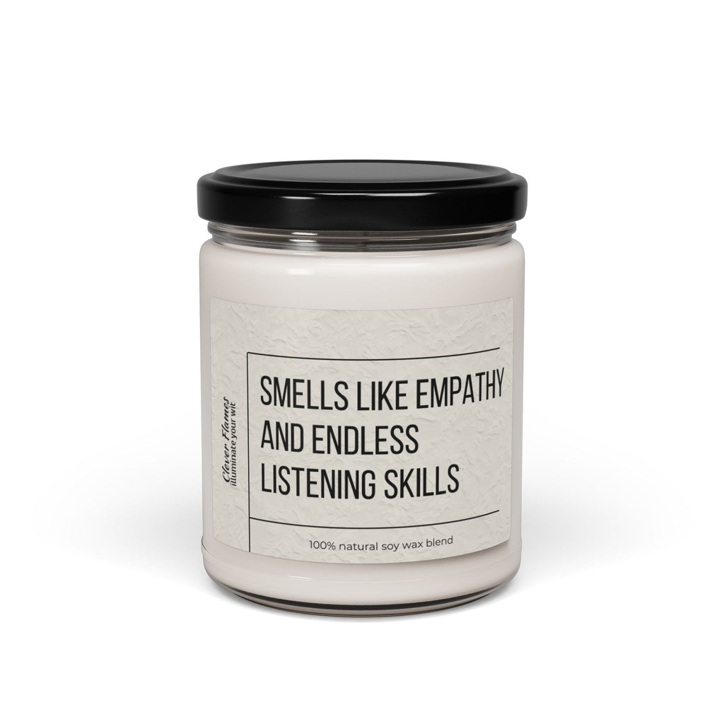 The Counselor Candle by Printify, part of their Gift For Counselor collection, showcases a white soy wax blend in a glass jar topped with an elegant black lid. Its label states, "Smells like empathy and endless listening skills," capturing the essence of natural warmth and understanding.