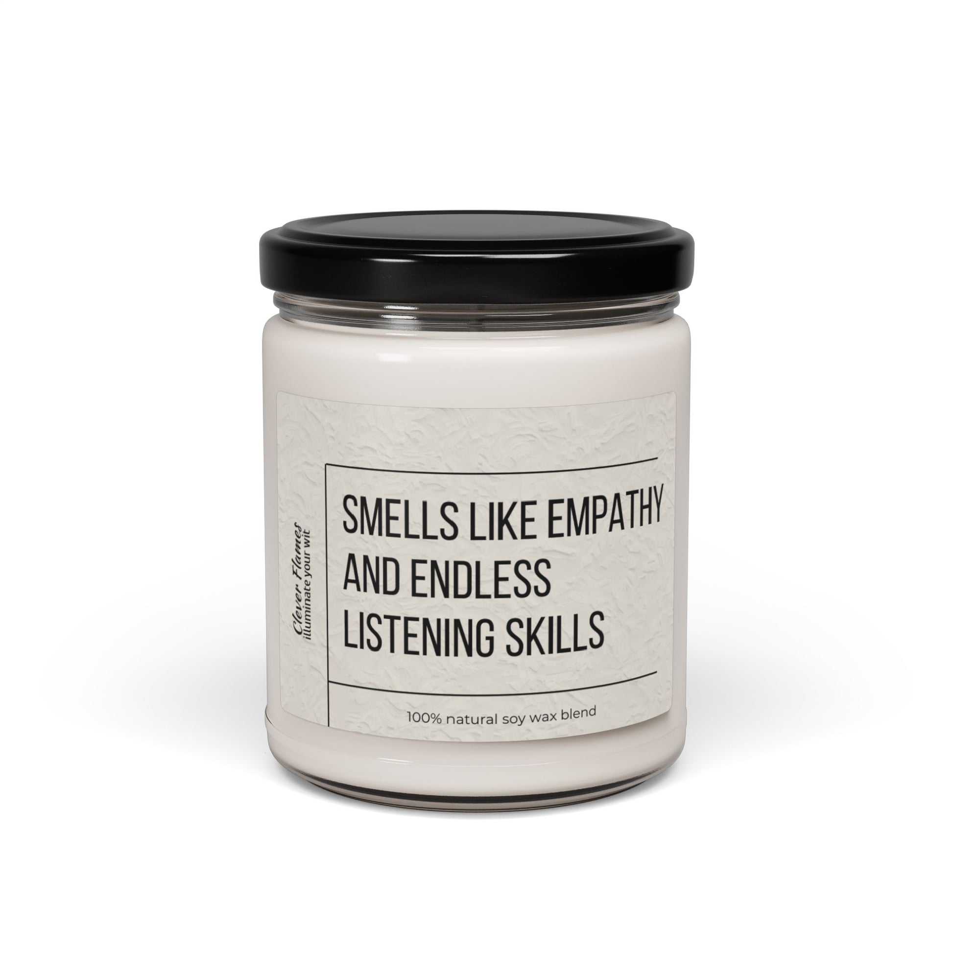 The Counselor Candle by Printify, part of their Gift For Counselor collection, showcases a white soy wax blend in a glass jar topped with an elegant black lid. Its label states, "Smells like empathy and endless listening skills," capturing the essence of natural warmth and understanding.