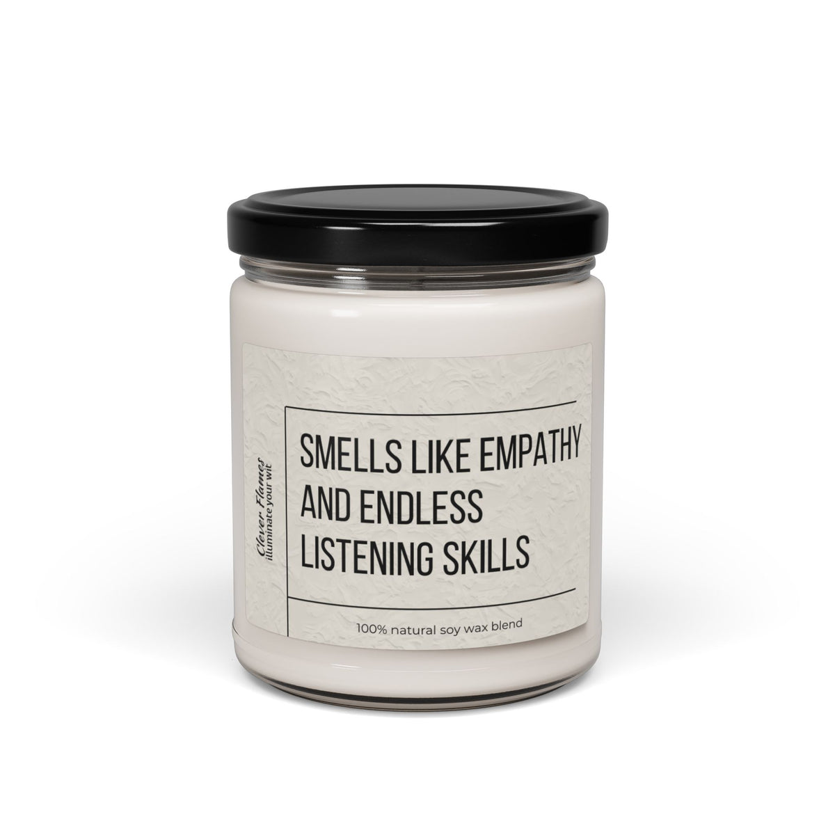 The Counselor Candle by Printify, part of their Gift For Counselor collection, showcases a white soy wax blend in a glass jar topped with an elegant black lid. Its label states, "Smells like empathy and endless listening skills," capturing the essence of natural warmth and understanding.