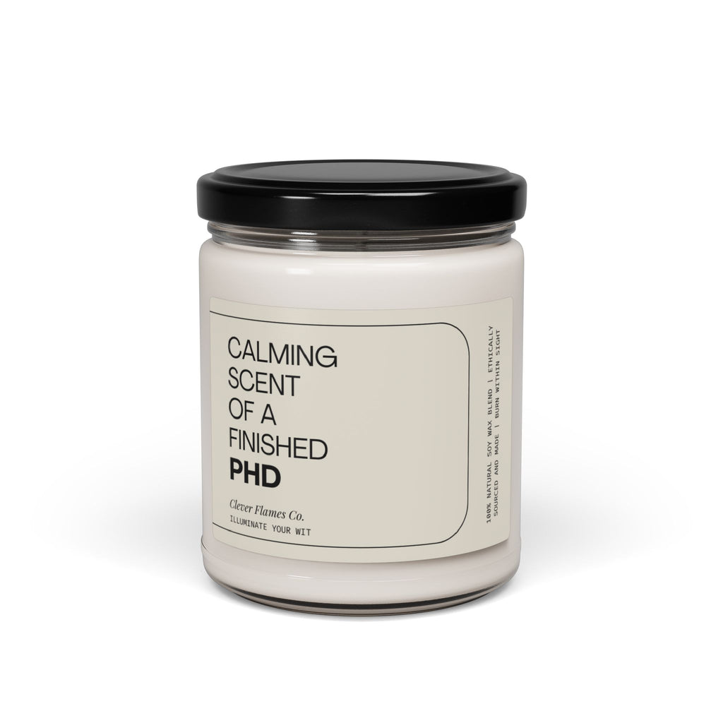 A glass candle jar with a black lid, labeled as "Finished PhD," serves as the perfect graduation gift, created by Printify to illuminate your wit.